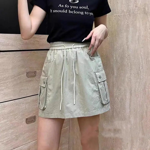 Load image into Gallery viewer, Korean Version Women Solid Drawstring Elastic Waist Lace-up Slim High Waist Work Short Skirt Summer Versatile Pockets Mini Skirt
