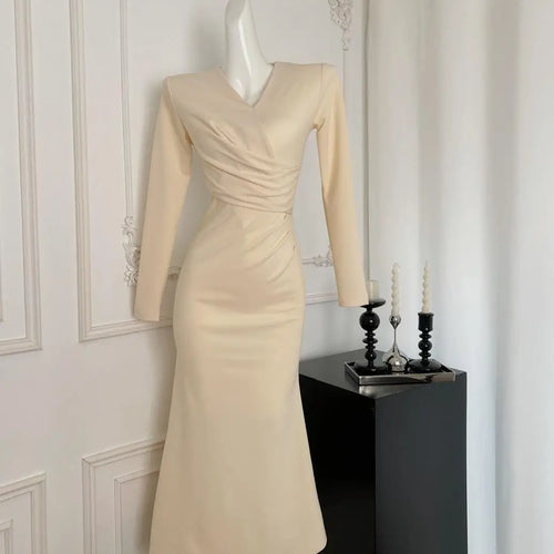Load image into Gallery viewer, French Fashion Women's Beige V Neck Long Sleeve Dress 2024 Autumn New Black High Waist Wrapped Hip Pleated Fishtail Dress Simple

