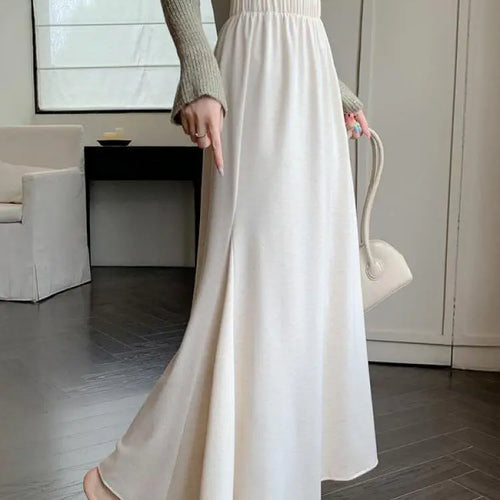 Load image into Gallery viewer, Autumn Winter Women's Black Elastic High Waist Fishtail Skirt Korean Version Beige Elegant Vacation Pleated A-line Long Skirts
