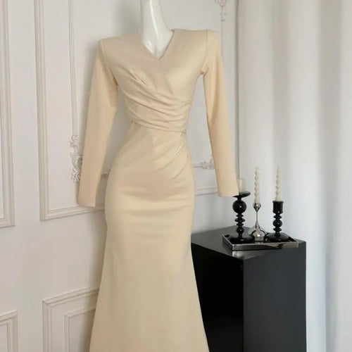 Load image into Gallery viewer, French Fashion Women's Beige V Neck Long Sleeve Dress 2024 Autumn New Black High Waist Wrapped Hip Pleated Fishtail Dress Simple
