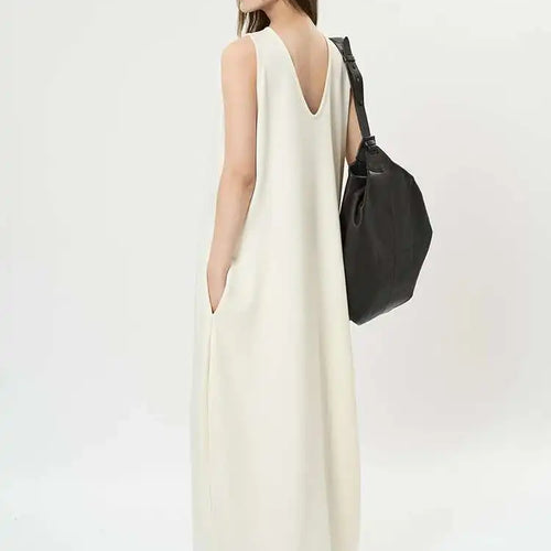 Load image into Gallery viewer, Women Black Brief Irregular Shaped Pocket Long Elegant Dress New V-Neck Sleeveless Fashion Tide Spring Autumn 2025 1DH9419
