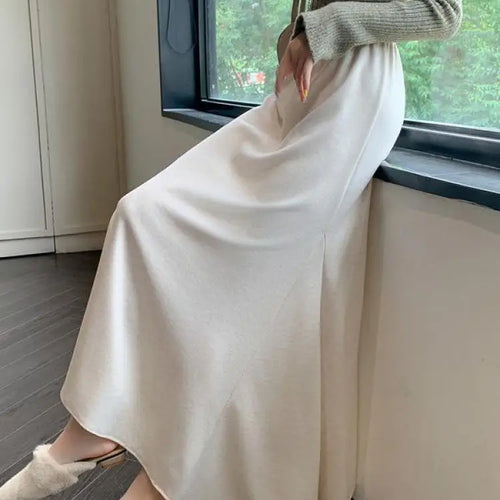 Load image into Gallery viewer, Autumn Winter Women's Black Elastic High Waist Fishtail Skirt Korean Version Beige Elegant Vacation Pleated A-line Long Skirts
