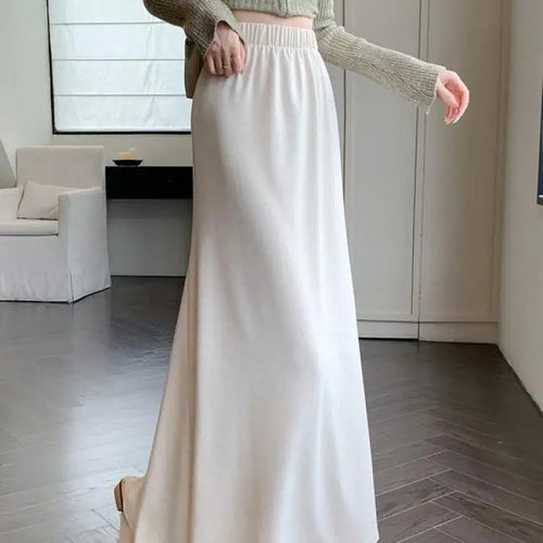 Load image into Gallery viewer, Autumn Winter Women's Black Elastic High Waist Fishtail Skirt Korean Version Beige Elegant Vacation Pleated A-line Long Skirts
