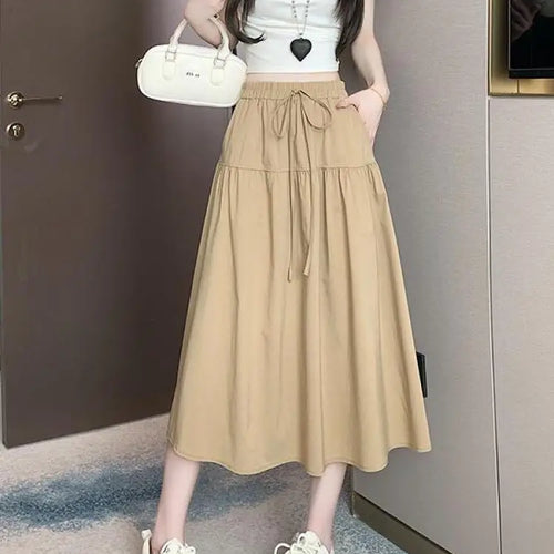 Load image into Gallery viewer, Korean Black High Waist Vacation Slim Pleated Long Skirt Spring Summe Women Khaki Elegant Lace-up Party Skirt Fashion Simplicity
