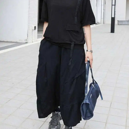 Load image into Gallery viewer, Women Black Irregular Button Pocket Big Size Casual T-shirt New Round Neck Short Sleeve Fashion Spring Summer 2025 1DJ0223
