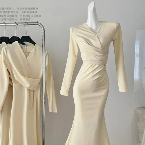 Load image into Gallery viewer, French Fashion Women's Beige V Neck Long Sleeve Dress 2024 Autumn New Black High Waist Wrapped Hip Pleated Fishtail Dress Simple
