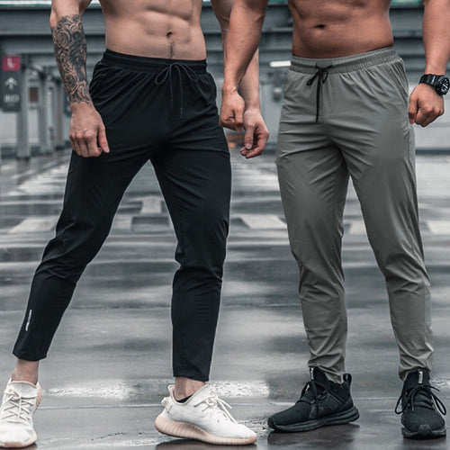 Load image into Gallery viewer, Men Sport Trousers with Pockets Running Workout Pants Quick Dry Training Jogger Sweatpants High Quality Fitness Bottoms
