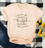 peach tee black text