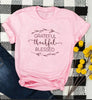 pink tee black text