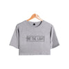 gray tee black text